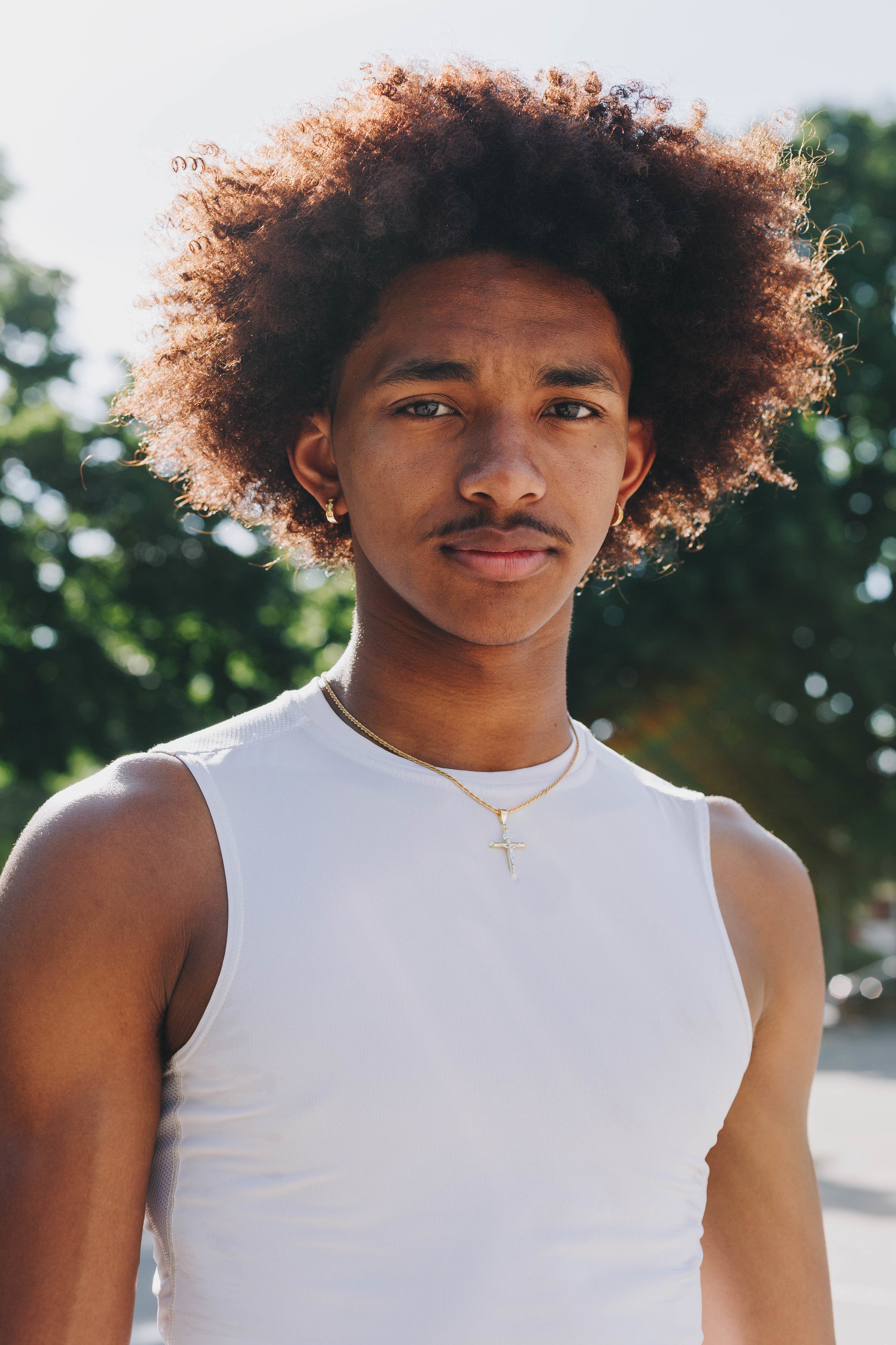 files/man-in-white-tank-top-stands-for-camera.jpg