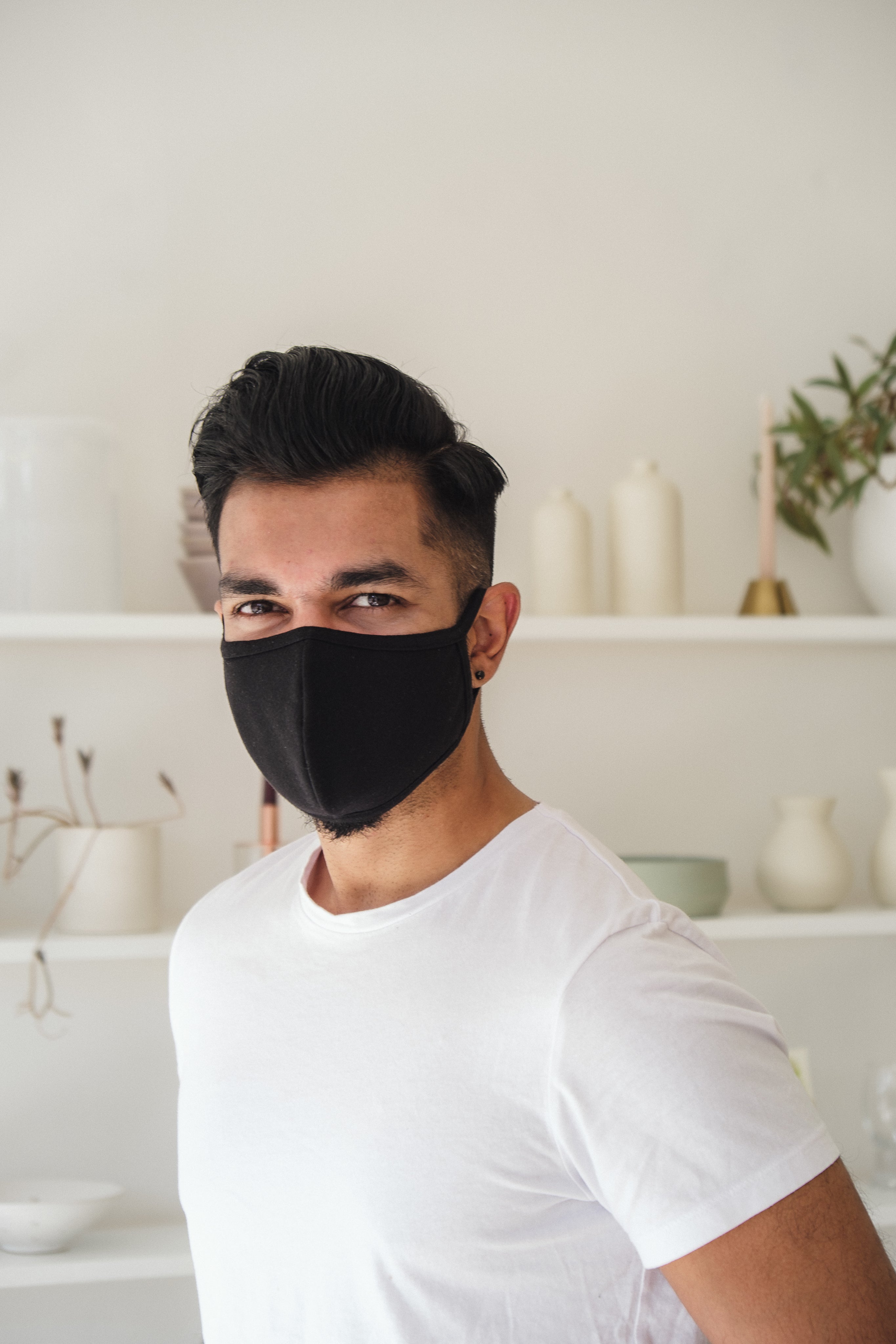 files/smiling-man-in-black-cloth-face-mask.jpg